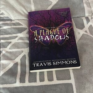 A Plague of Shadows by Travis Simmons - Purple Fantasy Paperback